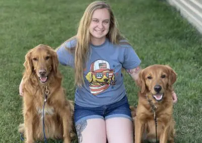 Dog trainer with 2 dogs